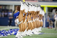 the cheerleaders are lined up on the field