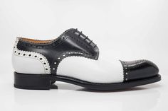 Style: 6529-1233-Blk/White Completely Handmade, this handsome Hand Burnished lace-up Spectator Blucher Oxford from the Ugo Vasare collection features Goodyear Welted construction, a cap-toe, decorative perforations with a toe medallion, Pinking detail, a clean, stitched welt, and a full Leather sole! Wide Sizes Available. Cordovan Shoes, Dressy Shoes, Formal Loafers, Wingtip Oxford, Shoe Tree, Leather Shoes Men, Goodyear Welt, Sneaker Brands, Formal Shoes