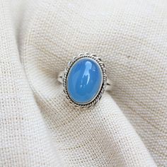 Gemstone - Blue Chalcedony Gemstone size - 12x16 mm oval shape Metal - Sterling Silver Ring Size- All sizes available Each Ring made with Precision and love, these rings are perfect for everyday use and a perfect accessory to wear at work. Rings can be customized on request and gemstone can be switched to any other as per requirement. kindly visit my store to view the complete collection. Feel free to contact me for any queries regarding jewelry or for bulk order. The ring will be gift wrapped i Oval Light Blue Jewelry For Gift, Oval Blue Cabochon Gemstones, Blue Oval Cabochon Gemstones, Light Blue Oval Jewelry For Gift, Oval Blue Cabochon Rings, Oval Turquoise Moonstone Ring, Adjustable Blue Oval Jewelry, Blue Oval Cabochon Opal Ring, Oval Blue Cabochon Jewelry