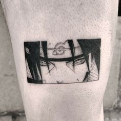 a man's leg with an anime tattoo on it