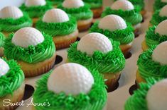 cupcakes with green frosting and white golf balls on top are arranged in rows