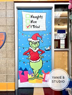 the grinch door is decorated with an image of santa's helper on it