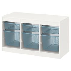 a white cabinet with four bins and blue handles