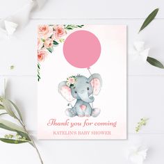 a baby shower card with an elephant holding a pink balloon on it's back