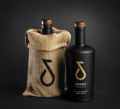 an empty bottle next to a burl bag on a black background with the word amoa printed on it