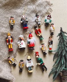 small christmas ornaments are arranged on a table