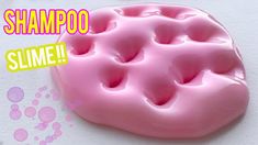 a close up of a pink doughnut on a white surface with the words shampoo slime