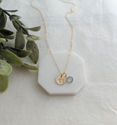 "So simple and tiny. The perfect \"wear it everyday\" necklace for the new mom or mom to be. The petite 3/8 inch charm has been hand stamped with a tiny footprint design. Includes one Swarovski crystal birthstone. Available in sterling silver or 14k gold fill. Chain length and birthstone month can be selected at checkout. ♥For more designs please visit my shop http://www.thestampedlife.etsy.com" Dainty Hand Stamped Charm Necklaces For Everyday, Dainty Hand Stamped Charm Necklace For Everyday, Small Personalized Charm Necklaces For Everyday, Personalized Small Charm Necklaces For Everyday, Dainty Stamped Charm Necklaces For Everyday, Stamped Charm Necklace For Mother's Day, Everyday Stamped Charm Necklace For Mother's Day, Mother's Day Hand Stamped Charm Necklaces, Dainty Personalized Small Charm Necklaces