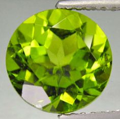 STUNNING ROUND FACETED GENUINE NATURAL PERIDOT LOOSE STONE This gorgeous stone would make a wonderful fine jewelry piece! Beautiful Round Faceted Peridot Gorgeous Apple Green Color Top Quality Gem with Astonishing Luster and Eye Clean Clarity Exquisite Gem for Fine Jewelry Take this opportunity to secure 1 or more of these marvelous gems at a well below wholesale price! This is the perfect gift for yourself or someone special. Hardness : 6.5 - 7 on Moh's Scale Specific Gravity : 3.2 - 4.3 Refrac Earth's Mantle, Peridot Green, August Birthstone, Tanzanite Gemstone, Loose Stones, Green Peridot, Green Sapphire, August Birth Stone, Apple Green