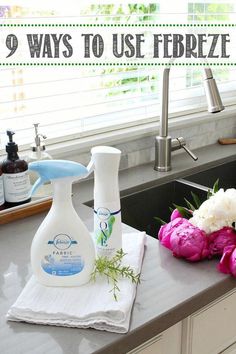 a kitchen sink with flowers on the counter and a spray bottle in front of it that says 9 ways to use ferreti