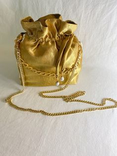 Gold fabric purse.  Gold plated chain.  22 inches x 9 inches Fabric Purse, Gold Purse, Fabric Purses, Sling Bags, Gold Fabric, Miami Fl, Gold Plated Chains, Cross Body Handbags, Purses And Handbags