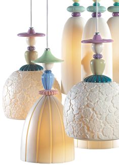 three different colored lamps hanging from the ceiling