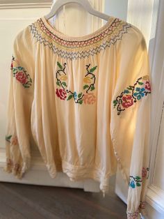 "Silk Peasant Top with Beautiful 'x' needlepoint effect (hand) embroidery  origin: from Eastern Europe  ca. 1930's Fabric: Silk * Mulberry washed effect (soft in hand) Color: Cream Natural  Body Specs: Body length: 18 1/2\" to band seam /  to sweep 20 3/4\" Bust: 22 3/4\" flat. *45 1/4\" fully Armhole: 10 1/2\" Sleeve length: from c.b 27 1/2\" Waist band ht: 2 1/8\" Width at seam: 14 3/4\"flat Neck width; 7\" *hook eye and snap closure at c.b neck. *button closure at waist band/ 1x each side   Condition:  Extremely good * considering age of garment. No holes/ stains/ or discolorations * a stylish life Store Policy: Purchasing Conditions: RETURN POLICY I am selling and showing all Authentic: vintage/ designer vintage/ or archival items as specifically listed. *each clearly noted in detail a Beige Embroidered Bohemian Peasant Top, Beige Bohemian Embroidered Peasant Top, Bohemian Peasant Top With Floral Embroidery, Cream Bohemian Peasant Top With Floral Embroidery, Bohemian Cream Embroidered Peasant Top, Cream Embroidered Bohemian Peasant Top, Cream Peasant Top With Floral Embroidery, Bohemian Peasant Top With Multicolor Embroidery And Floral Print, Vintage Embroidered Peasant Top For Festival