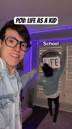 a person with glasses holding up a sign that says pov life as a kid