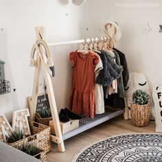 a rack with clothes and other items in a room