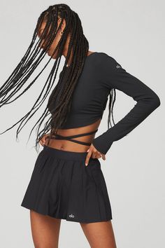 Wear it your way. The Ribbed Manifest Long Sleeve can be cinched and tied in infinite ways, thanks to an open back, long ties and a jersey lining. Made from ultra-soft fine knit sweater rib, this long sleeve top is easy and breezy for every day. Wear it to-and-from with sweats, flares or relaxed fit pants. Open back and long ties for custom cinching & tying Made from ultra-soft fine knit sweater rib Designed & uniquely fit to flatter every size Wear-tested by our in-house team for the pe Black Stretch Top With Tie Back, Long Sleeve Stretch Top With Tie Back, Dance Fits, Relaxed Fit Pants, Fine Knit Sweater, Woman Back, Back Women, Fit Pants, Black Sneakers