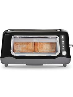 a toaster oven with four slices of bread in front of it on a white background