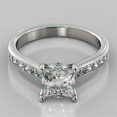 a princess cut diamond engagement ring with channel set diamonds