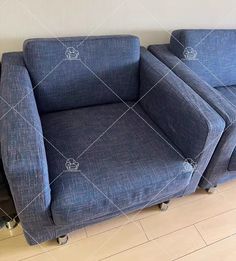 two blue couches sitting next to each other