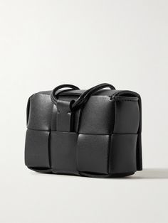 Bottega Veneta's case is a practical yet elevated way to keep your AirPods Pro secure and easily accessible. It's constructed from supple leather using the signature intrecciato weave and comes with a lanyard strap and a silver keyring etched with the brand's moniker. Modern Rectangular Cases With Card Slots, Modern Leather Rectangular Cases, Modern Leather Wallet In Rectangular Case, Modern Leather Protective Case, Functional Leather Rectangular Wallet, Modern Rectangular Protective Case, Textured Leather Rectangular Wallet, Rectangular Textured Leather Wallet, Modern Textured Leather Rectangular Wallet