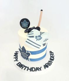 a birthday cake with hockey themed decorations on it