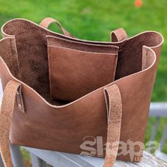 Long awaited, and perfect for the ren faire or the grocery store- we present our Customizable Tote Bag. Beautiful oil tan leather will age gloriously, and the stitching reinforced by copper burr rivets is sure to stand the test of time. The Medium is approx. 10.5" tall, 12" wide, and 6" deep The Large is approx. 12" tall, 14" wide, and 6" deep There are a slew of other options you can add or skip, to make it perfect for your needs. If you have questions about leather colors, availability, etc. P Distressed Brown Oiled Leather Bag For Daily Use, Everyday Distressed Brown Rectangular Satchel, Distressed Brown Everyday Rectangular Satchel, Distressed Brown Rectangular Satchel For Everyday Use, Distressed Brown Everyday Bag, Rectangular, Distressed Brown Everyday Rectangular Bag, Distressed Brown Rectangular Bag For Everyday Use, Rustic Brown Shoulder Bag With Leather Handles, Distressed Brown Leather Shoulder Bag With Rectangular Shape