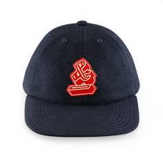 An Autumn addition to our cap collection, our retro-styled, 6-panel cap has been reborn in stunning Navy toned wool. The cap features a quilted lining for extra insulation and an interior padded sweatband. Detailed with an ‘&’ patch on the front and finished with embroidered eyelets for breathability. One size fits all, with our woollen back adjuster on the back. The cap features 6 rows of detailed stitching, and like all of our clothing, this cap will age over time and look better the more you Ikat Scarf, Leather Braces, Tweed Hat, Woolen Cap, Baker Boy Hat, Ivy League Style, Cap Collection, Snapback Caps, Watch Cap