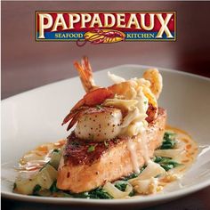 the cover of crispy atlantic salmon with shrimp, pasta and spinach on it