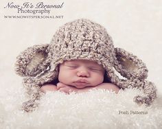 a baby wearing a crocheted hat laying on top of a white blanket with the words you're personal photography written above it