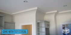 an empty room with white walls and blue lettering on the wall that says cove with top reveal