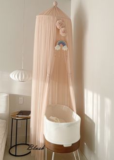 a baby's crib in the corner of a room next to a wall