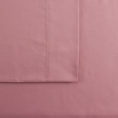 the pink sheets are folded on top of each other