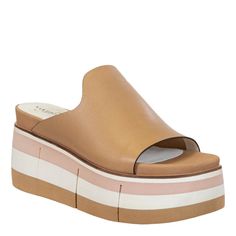 Slide in to the effortless direction of Flow in mist. This soft leather sandal features an uncomplicated silhouette, designed to fit simply into an affluent wardrobe of modern style. The multi tone lightweight platform gives it a subtle athleisure twist while maintaining its enchanting boho style. Features:- Women's slip-on sandal- Crafted with genuine leather- Inked leather edges- Luxury athleisure and boho style- Foam padded sock- 2.87" Layered EVA sole with flex grooves- 1.97" Platform Luxury Athleisure, Soft Leather Sandals, Women Platform Sandals, Modern Wardrobe, Slide In, Platform Wedge, Shoes With Jeans, Brown Sandals, Metallic Leather