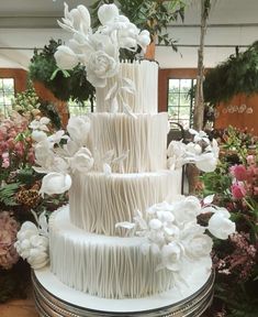 a large white cake sitting on top of a table