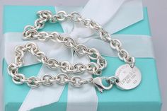 Tiffany & Co. Sterling Silver  Please Return To Tiffany Oval Tag Choker Necklace w/Box and Pouch  ────────────────────────────────────────────────────────────────────────────────────────────────  100% Guaranteed Authentic Professionally Polished To Shine Like New Includes Tiffany Packaging (Tiffany box and Pouch) Size & Measurements: about 16" from end to end Tag is 20mm Metal & Hallmarks: Tiffany & Co New York 925 On Tag Thank you for Looking!! Tiffany And Co Return To Tiffany Necklace, Tiffany And Co Toggle Necklace, Return To Tiffany, Silver Necklaces Tiffany & Co., Tiffany And Co Heart Tag Toggle Necklace, Hardware Necklace Tiffany, Tiffany Box, Necklace Box, Fine Jewellery Necklace