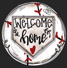 a sign that says welcome home with hearts and arrows in the center on a plate