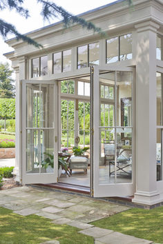 The atmosphere of a conservatory or orangery is incomparable when it comes to creating a bright, calming, and relaxing place to spend time in. Interior Bifold Doors, Vogue Decor, Sunroom Addition, French Doors Exterior, Doors Ideas, Sunroom Ideas, Enclosed Patio, Transitional Decor Kitchen