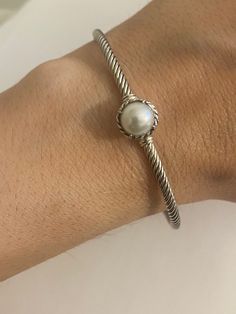 Previously USED David Yurman PEARL BRACELET CHATELAINE COLLECTION 100% Authentic Excellent Condition  cable band is 3mm Estimated Retail $395-$495 925 Sterling Silver 3mm Width  7.5-8mm Cultured PEARL Size MEDIUM : Diameter is about near 2.3" Inside Circumference a little over 7" Collateral: Pouch guarantee: 100% Pearl Bangle, Chatelaine, Pearl Size, David Yurman, Cultured Pearls, Pearl Bracelet, Sterling Silber, Arm Band, Bangle Bracelets