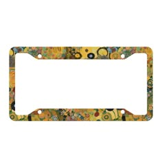 a license plate frame with flowers and circles on the front, in yellow tones that are painted