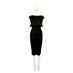 Very rare, jet-black dress with wide elasticized waist and draped bodice from Azzedine Alaia dating to 1984. Labeled a size 'XS'. Approximate measurements (unstretched): bust is open, waist 22" (stretches), hips 33" (stretches) and overall length 44". Slips on over the head. Straps can easily be shortened. fabric content: 88% viscose and 12% nylon. Made in Italy. Very good condition. Azzedine Alaia 90s, Alaia Mini, Stretches Hips, 1970 Dress, Evening Dress Black, Azzedine Alaïa, A Lot Of Clothes, High Low Gown, Bustle Dress