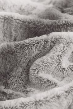 black and white photograph of the back of a blanket that has been made with fur