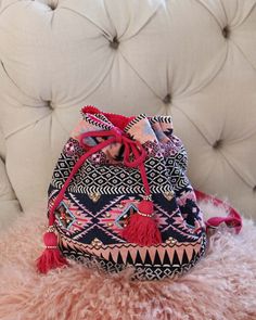 Gorgeous beaded tapestry details adorn this backpack. Designed with a tassel top cinch closure, adjustable backpack straps, a fully lined interior, and three inner pockets for storage. Not to small, but not to big... perfect for everyday use. Width: 14" Height: 12" Cheap Bohemian Multicolor Backpack, Pink Backpack For Vacation, Bohemian Backpack With Adjustable Strap For Travel, Bohemian Pink Bucket Bag For Travel, Pink Bohemian Bucket Bag For Travel, Bohemian Woven Backpack For Daily Use, Bohemian Backpack With Adjustable Strap For Festivals, Pink Tassel Bag For Travel, Bohemian Festival Backpack