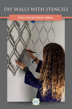 a woman writing on a wall with the words diy walls with stencils easy home decor ideas