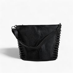 Elevate your everyday style with this classic black leather shoulder bag, designed for those who appreciate both functionality and elegance. This expertly handcrafted bag is made from high-quality genuine leather, showcasing a unique textured pattern and decorative leather straps on the sides that add a touch of sophistication. Key Features: Functional Interior: The bag features an inner zipped pocket, perfect for securing your valuables, and an open pocket designed for easy access to your cell Fox Fur Scarf, Black Leather Shoulder Bag, Handcrafted Bags, Bag Stand, Matching Accessories, Basket Weave, High Quality Leather, Embossed Leather, Leather Tote