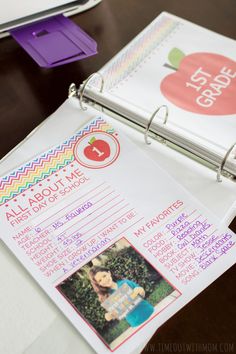 a close up of a binder on a table with an apple label attached to it