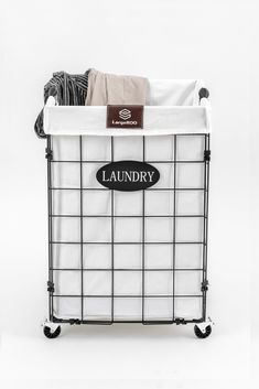 the laundry basket is on wheels and has a label that says laundry