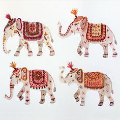 three elephants with designs on their body and one is painted in red, white and gold