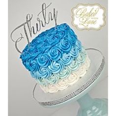 a blue and white cake with the words thrift written on it's side