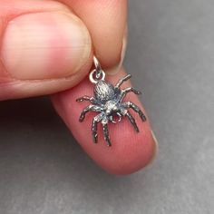 Sterling Silver Spider Charm with 6mm sterling silver open jump ring. The finished charm measures 17mm x 12mm.  This listing is for 1 charm. MORE Charms, Dangles and Pendants: http://www.thedanglediva.etsy.com FOLLOW me: www.facebook.com/thedanglediva for new designs and discount coupons INTERCHANGEABLE EARRINGS: https://www.etsy.com/shop/TheDangleDiva?ref=hdr_shop_menu&section_id=20069837 NECKLACE CHAINS: https://www.etsy.com/shop/TheDangleDiva?ref=hdr_shop_menu&section_id=10168783 CUSTOM ORDER Silver Novelty Jewelry With Lobster Clasp, Novelty Silver Pendant Jewelry, Silver Novelty Charm Necklace, Novelty Pendant Jewelry With Charms, Silver Halloween Charms Jewelry, Halloween Silver Charm Jewelry, Silver Halloween Jewelry With Charms, Halloween Novelty Jewelry With Charms, Novelty Sterling Silver Charm Jewelry