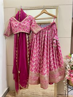 This is a Custom made Lehenga Choli dupatta.  I make it exclusively for my customers by using designer fabrics. I will only make it after you confirm your required size details. Handling time: Don't worry, just tell me, I will process it accordingly and deliver on or before a delivery date you mention. Size: This is custom made as per your size. This is not available in plus size. Post your order I will send you a measuremnts reference sheet using which you can provide details required to make your outfit. Fabric and work: Lehnga made in Embroidered silk Banarasi  fabric. Blouse is in heavy embroidered silk Dupatta is in Net with embroidery lace border on all sides of it. Dupatta is decorated with beautiful Sequine work all over as shown in the picture. Pink Silk Sharara For Wedding, Pink Silk Anarkali Set For Wedding, Traditional Dupatta Sets For Ceremony, Wedding Pink Silk Sharara, Traditional Ceremony Sets With Dupatta, Ceremony Sets With Traditional Drape Dupatta, Art Silk Unstitched Blouse Set For Wedding, Bollywood Style Sharara With Dupatta For Ceremonies, Pink Silk Lehenga For Wedding